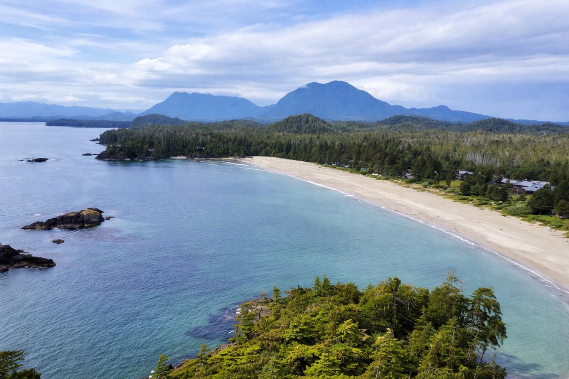 Beautiful Long Beach in Tofino with wide sandy shore and calm ocean during a Tofino Tour Packages trip